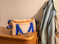 Borsa Mustela Re-Love - design beige con dettagli blu e arancio